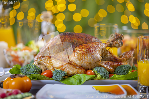 Image of Roasted turkey on festive table for Thanksgiving celebration