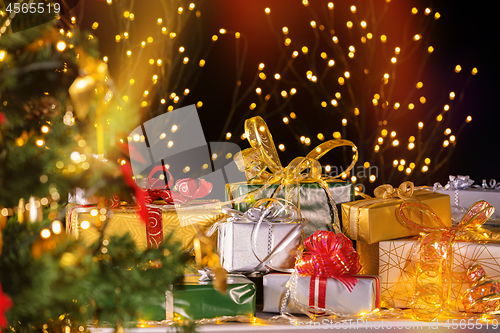 Image of Christmas presents under Christmas tree