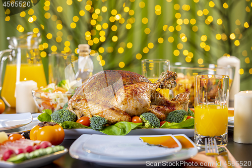 Image of Roasted turkey on festive table for Thanksgiving celebration