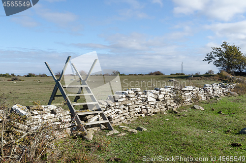 Image of Wooden stile crossing an old dry stone wall