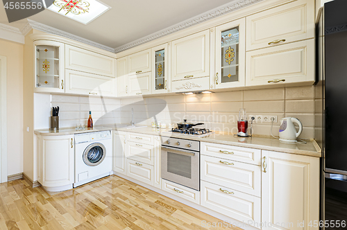 Image of Luxury modern beige and white kitchen interior