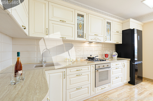 Image of Luxury modern beige and white kitchen interior