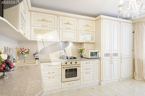 Image of Luxury modern beige and cream colored kitchen interior