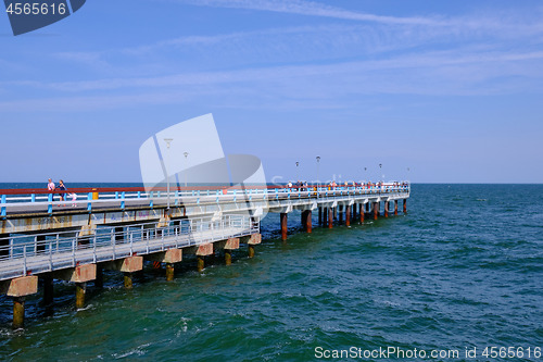 Image of Boardwalk pier in Baltic Sea udnder cloudy sky
