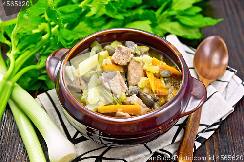 Image of Soup Eintopf in clay bowl on napkin