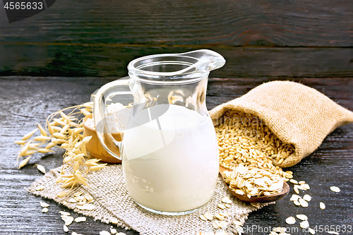 Image of Milk oatmeal in jug on napkin