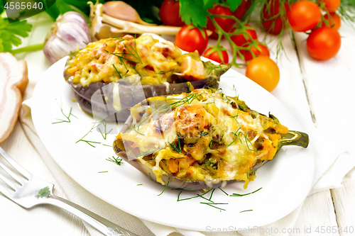 Image of Eggplant stuffed smoked brisket in plate on wooden table