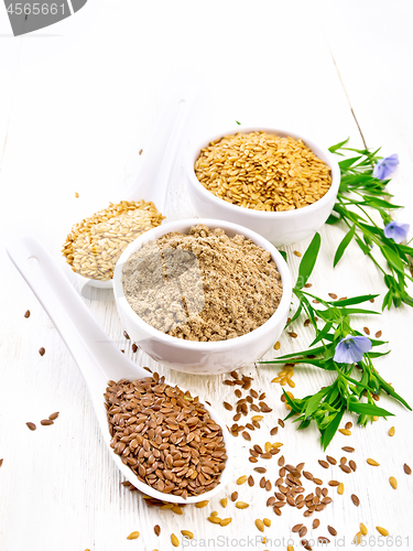 Image of Flour linen in bowl with seeds on white wooden board