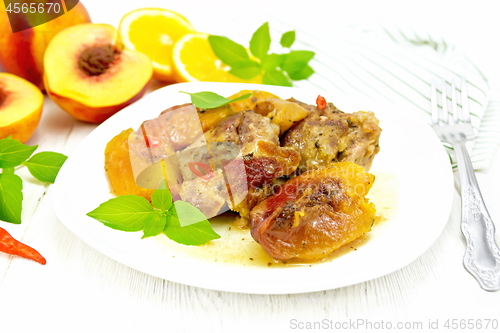 Image of Turkey with peaches in plate on light board