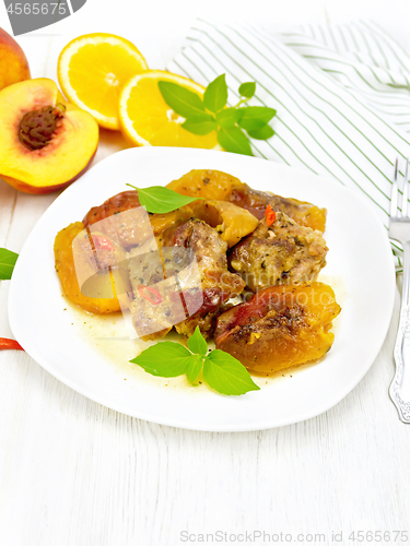 Image of Turkey with peaches in plate