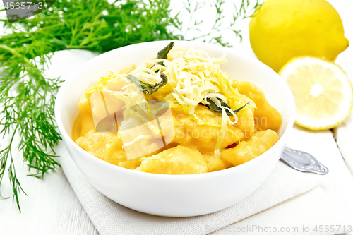 Image of Gnocchi pumpkin with lemon in bowl on white board