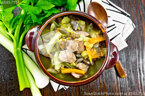 Image of Soup Eintopf in clay bowl on board top