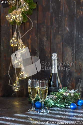 Image of Champagne glasses on the Christmas table.