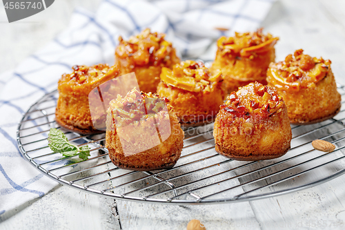 Image of Cupcakes with caramelized orange on a metal grill.