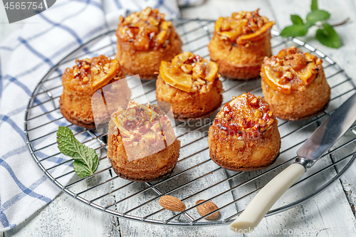 Image of Delicious cupcakes with orange and almonds.