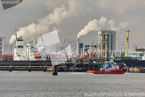 Image of Industrial port and facilities smoking in the background