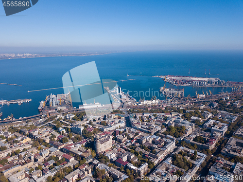 Image of Aerial view of the drone on the city of Odessa and the sea with a maritime station against a blue sky on a sunny day