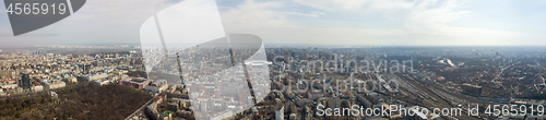 Image of Panoramic aerial view from drone. on the city of Kiev with a railway and a stadium in the distance against the sky.