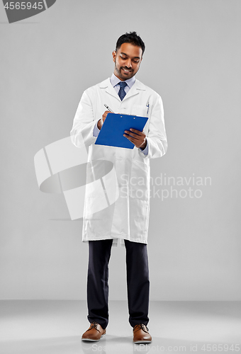 Image of smiling indian doctor or scientist with clipboard