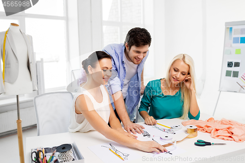 Image of team of fashion designers working at office