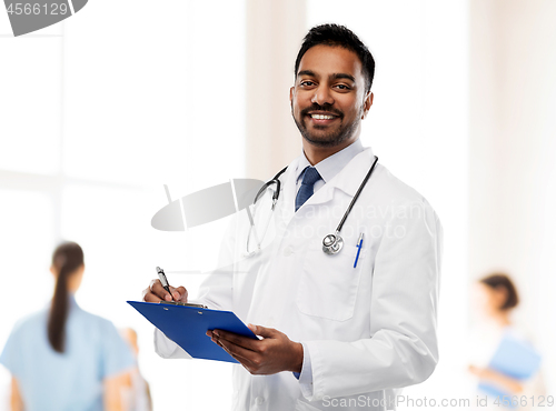 Image of indian male doctor with clipboard and stethoscope