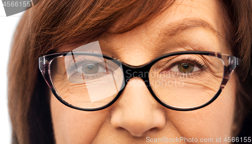 Image of close up of face of senior woman in glasses