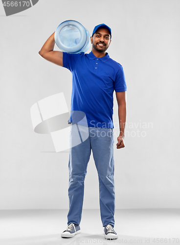 Image of happy indian delivery man with water barrel