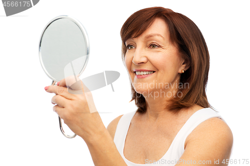 Image of portrait of smiling senior woman with mirror