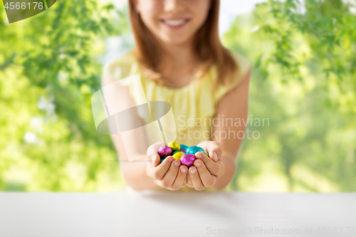 Image of close up of girl holding chocolate easter eggs