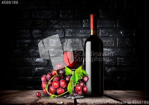 Image of Bottle red wine and grapes