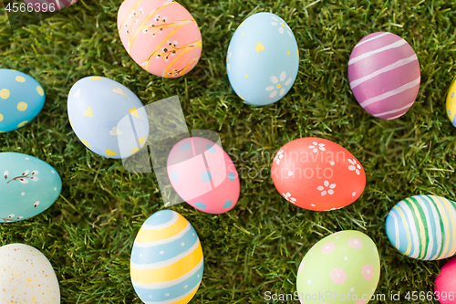 Image of colored easter eggs on artificial grass