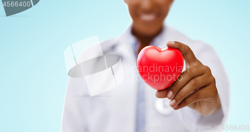 Image of african american doctor hand holding red heart