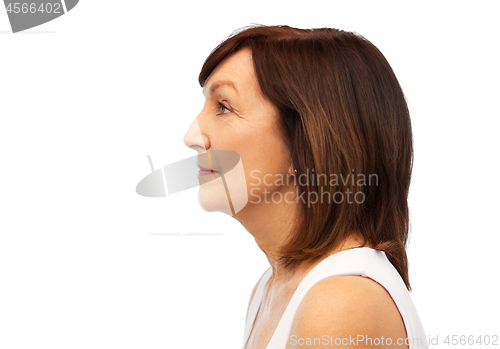Image of profile of senior woman over white background