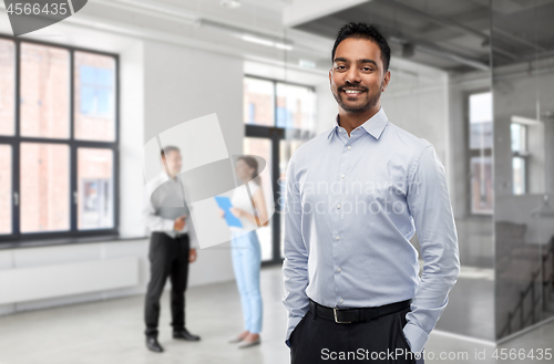 Image of indian businessman or realtor in empty office room