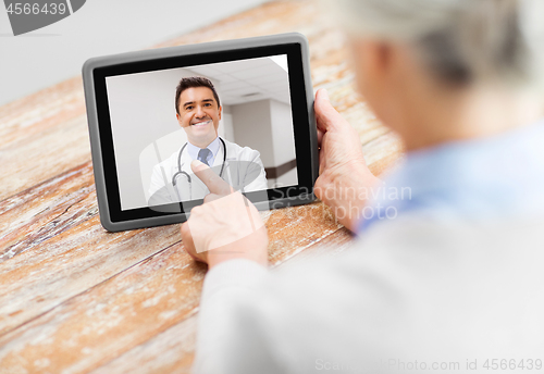 Image of senior woman patient having video call with doctor