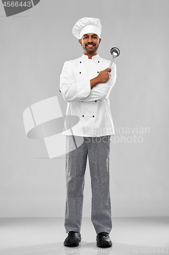 Image of happy male indian chef in toque with ladle