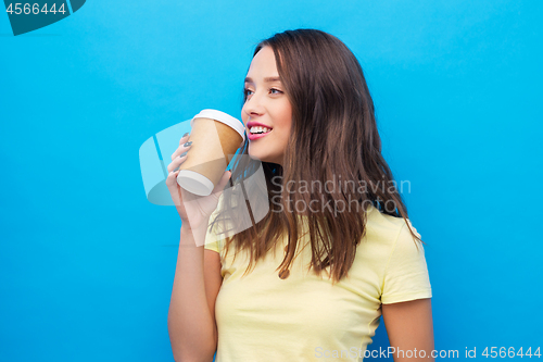 Image of young woman or teenage girl drinking coffee