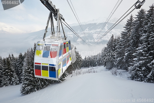Image of Skiing lift cabin over a valley