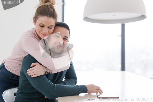 Image of couple hugging in their new home