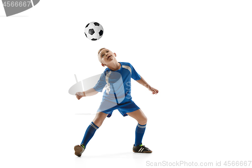 Image of Young boy with soccer ball doing flying kick