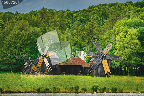 Image of Windmills on the Bank of Lake