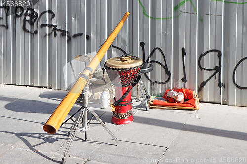 Image of Didgeridoo and jembe drum on the city street