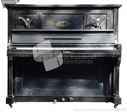 Image of Old wooden black vintage piano isolated on white background