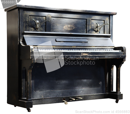 Image of Old wooden black vintage piano isolated on white background
