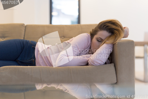 Image of Woman Sleeping On Sofa