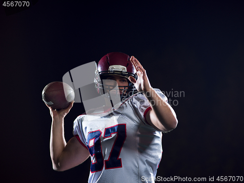 Image of american football player throwing rugby ball