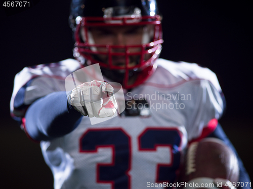 Image of portrait of confident American football player