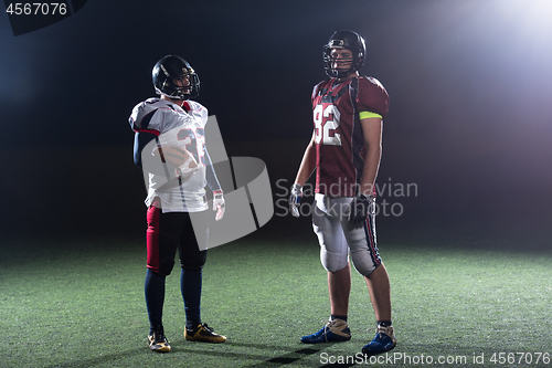 Image of portrait of confident American football players