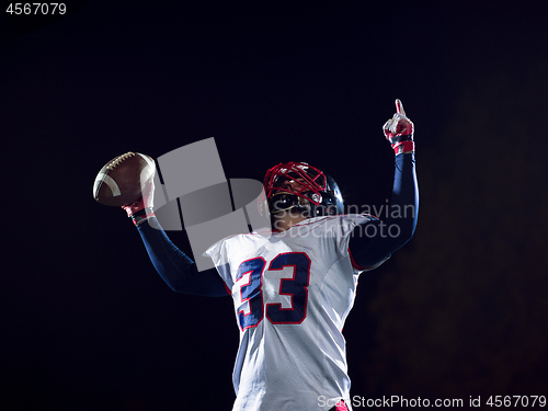 Image of american football player celebrating after scoring a touchdown