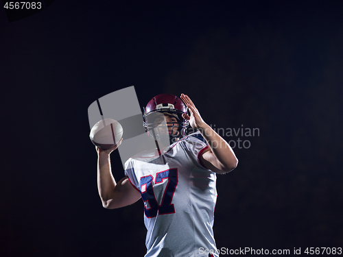 Image of american football player throwing rugby ball